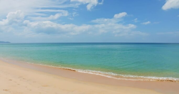 Amazing sea beach with ocean wave foams.Beautiful nature beach sand sea surface,Waves crashing on sand,Wide angle lens