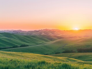 Obraz premium A majestic mountain landscape bathed in the warm glow of a sunrise, with fluffy clouds scattered across a vibrant sky