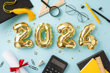 Commemorative setting: Top view of shimmering gold balloons, cap, diploma, study materials, books, pens, clips, calculator, rulers, magnifying glass, glasses, confetti, tinsel on pale blue base