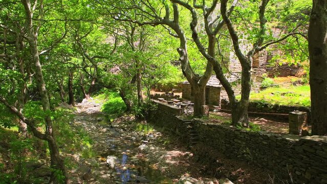 Old watermill building of Aris by river at coastal town of Karavostamo on Ikaria island, Greece at longevity blue zone