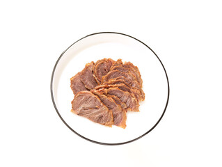 A plate of gourmet beef on a white background
