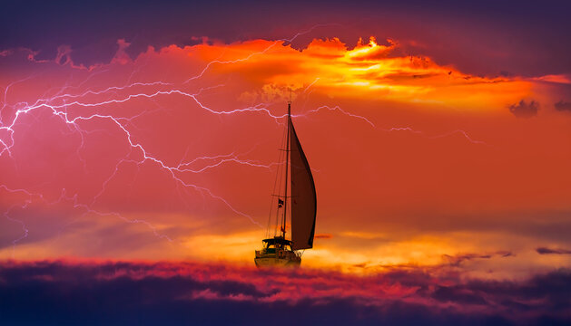 Sailing yacht in a stormy weather with thunder and lightning 