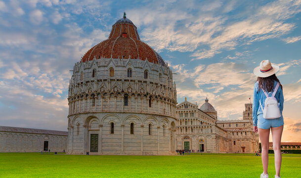 Cathedral (Duomo of Santa Maria Assunta) and The Baptistery of Pisa Leaning Tower at the Piazza dei Miracoli or the Square of Miracles - Pisa, Italy