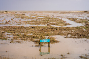Sign: No access to beach on flooded land near Bradwell, Essex, England