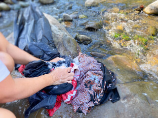 Laundry at river background. Stock photo.