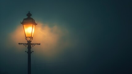 Fototapeta na wymiar An old-fashioned street lamp glows softly, its light cutting through the thick fog of a quiet, mysterious night.