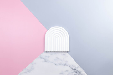 Top view of white arch tray on colourful background. Blue, pink and marble background. Product...