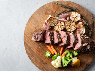 grilled beef steak with roasted garlic	