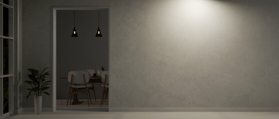 The interior design of a modern loft home corridor at night with a doorway through a dining room.