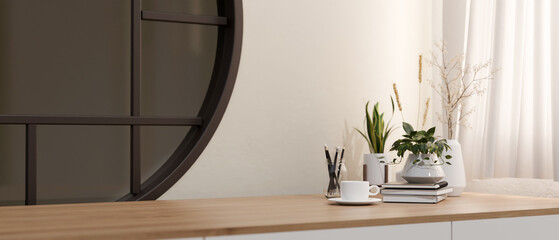 A minimalist wooden table with a space for display products against a white wall with a round...