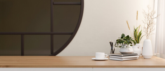 A minimalist wooden table with a space for display products against a white wall with a round...