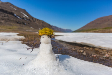 Spring on Putorana plateau. Little snowman is melting