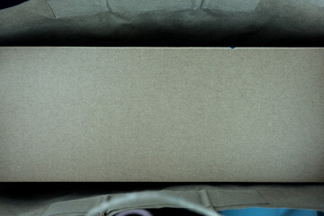 Brown paper shopping bag with cardboard box, top view