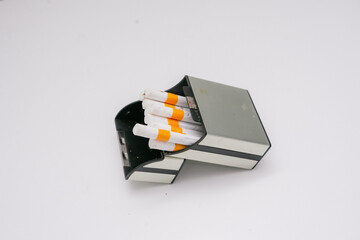 Several cigarettes and their packaging made of sturdy plastic show the elegance of a cigarette
