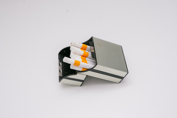 Several cigarettes and their packaging made of sturdy plastic show the elegance of a cigarette