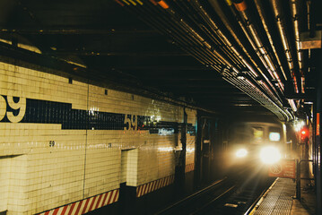 A Fast Train arriving on a Platform in New York City Subway