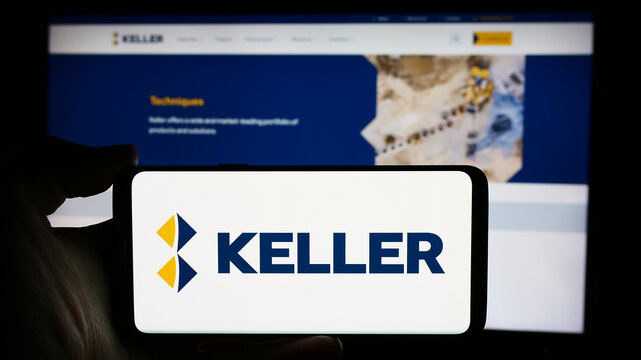Stuttgart, Germany - 03-23-2024: Person holding cellphone with logo of geotechnical engineering company Keller Group plc in front of business webpage. Focus on phone display.