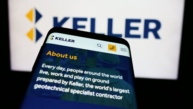 Stuttgart, Germany - 03-23-2024: Mobile phone with website of geotechnical engineering company Keller Group plc in front of business logo. Focus on top-left of phone display.
