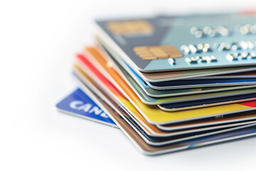 Cose-up of credit card on white background. Credit card payment for purchases, business financial and banking concept. - obrazy, fototapety, plakaty
