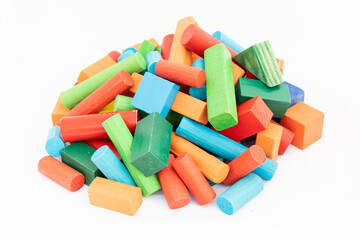 Multicolor and various shapes of wooden blocks heap on white isolated background