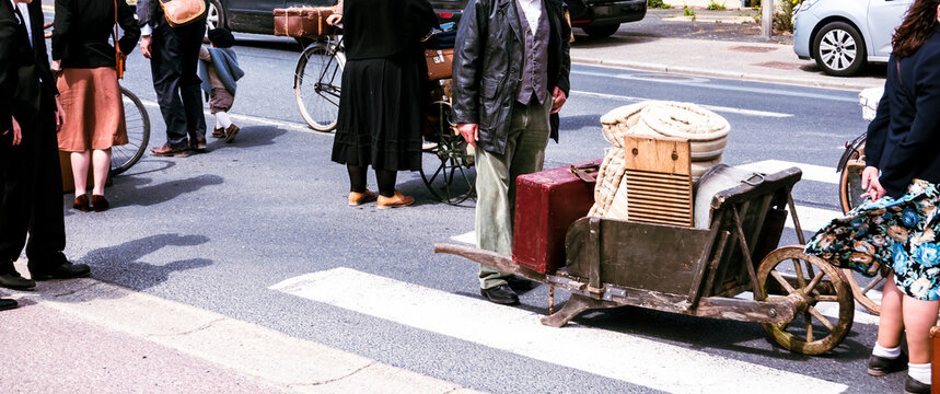 Second world war commemoration at SAINTE MERE L'EGLISE In Normandy, FRANCE. Families exodus due to war reconstitution