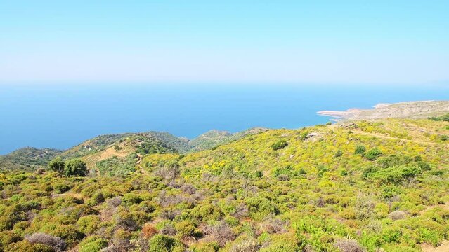 Perdiki village view on Ikaria island northern shore coast, Greece with airport runway and landscape nature view