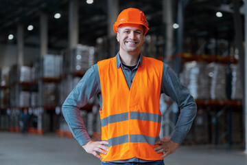 Happy, professional man, foreman, builder wearing hard hat, looking at camera with crossed arms