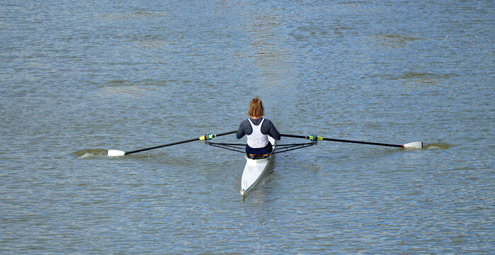 Female Sculler on the river Ouse at Bedford.