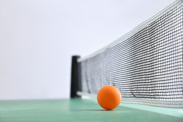 Ping-pong background with ball on green table and white background