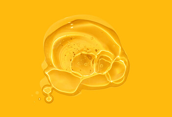 Liquid yellow lemon cosmetic gel or serum texture smudge background