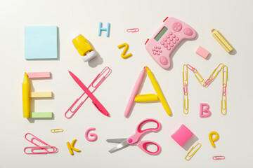 Exam, inscription on the table, on a light background.