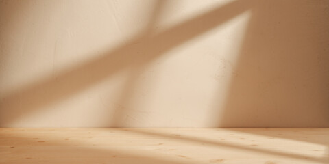 Wooden table mockup on stucco background with window shadow on the wall. Mock up for branding...