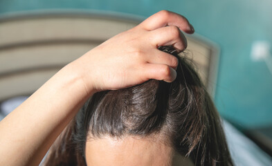 Fototapeta premium Caucasian woman showing her hair.