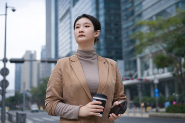 Confident Businesswoman Navigating City Life - 777006548