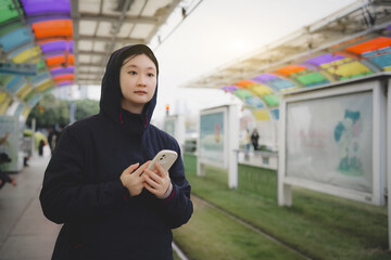 Colorful Commute: Young Adult Using Smartphone