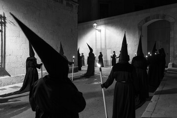 Penitents of a Catholic procession at Holy Week in Spain - obrazy, fototapety, plakaty
