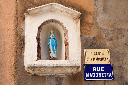 In Bonifacio, in Corsica (nicknamed the Island of Beauty) we find Madonetta street (U cantu di a Madonetta) or street of little Madonna, because of the statuette located at the corner of a house