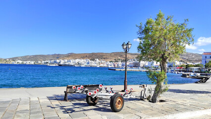 Photo of Tinos, a gorgeous Cycladic island in Greece, and its scenic harbor.