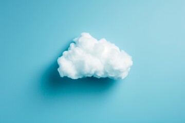 A cloud hovers above, floating gracefully against a vibrant blue background, A minimalist representation of cloud computing and storage, AI Generated