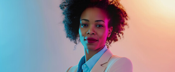Studio portrait of beautiful young professional black woman wearing pink suit, boss lady concept