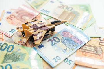 Military toy airplane jet aircraft - on money background