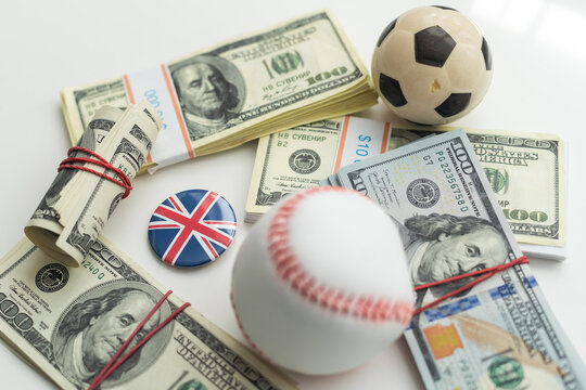 Small balls on heap of dollars isolated on a white background