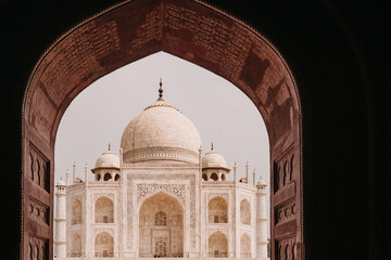 Obraz premium View of the Taj Mahal. The Taj Mahal is an ivory-white marble mausoleum on the south bank of the Yamuna River. Agra, Uttar Pradesh, India.