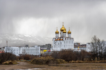 City of Magadan, Magadan region, Far East of Russia. View of the Holy Trinity Cathedral. Rainy autumn weather. There are clouds in the sky.