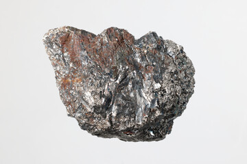 Ferrochromium (ferrochrome) piece on white background. Used for stainless steel production....