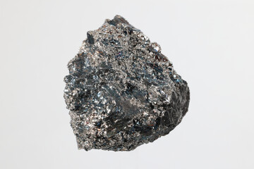 Ferrochromium (ferrochrome) piece on white background. Used for stainless steel production. Produced in South Africa, China, Kazakhstan, India, Russia, Finland. Copy space.