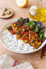 Fried tofu with rice and salad. Vegetarian food. Healthy eating. Diet.