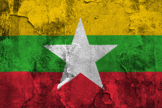 Republic of the Union of Myanmar Flag Cracked Concrete Wall Textured Background