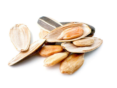 Close-up of delicious black sunflower seeds Natural agricultural seeds isolated on white background.