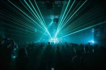 a big crowd of people celebrating at a rave party in front of the stage with an impressive lasershow